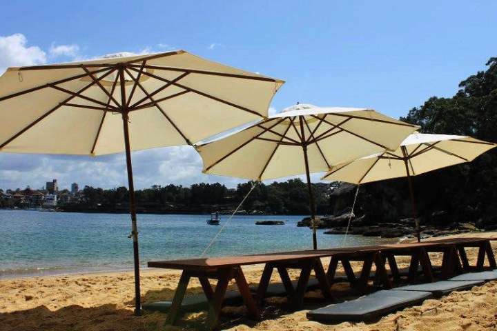 Beach umbrella and chair on the shore