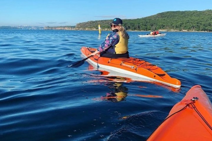 a man rowing a boat in the water