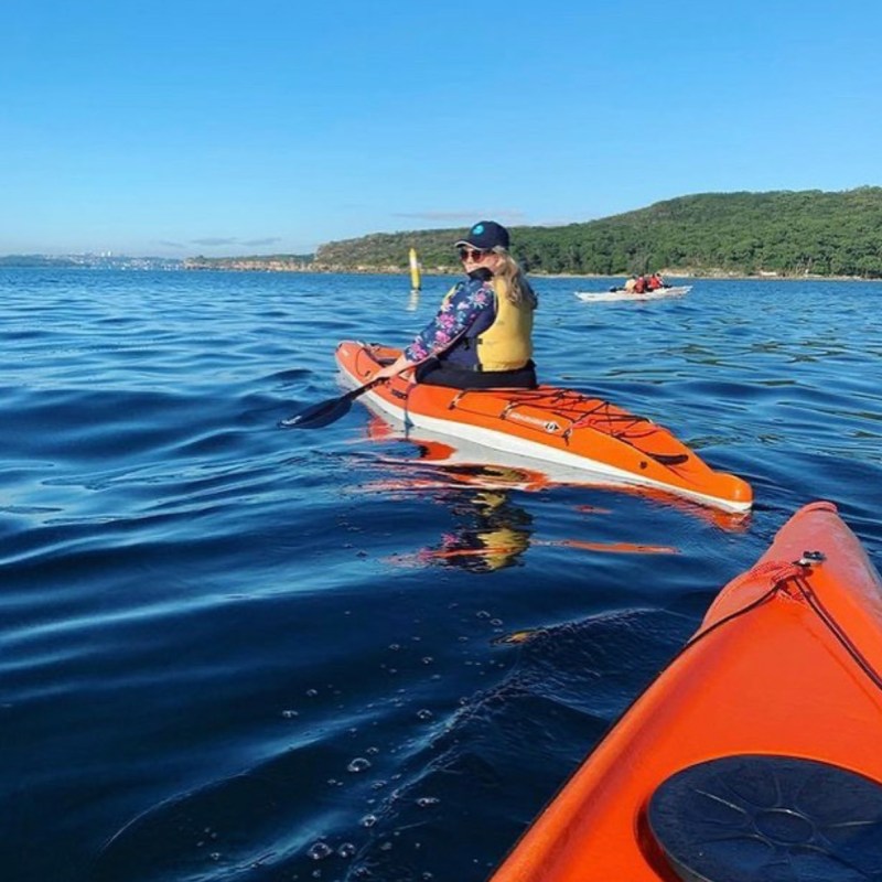 a man rowing a boat in the water