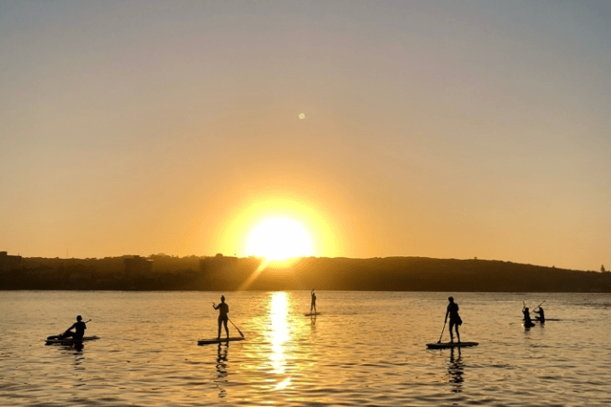 a sunset over a body of water