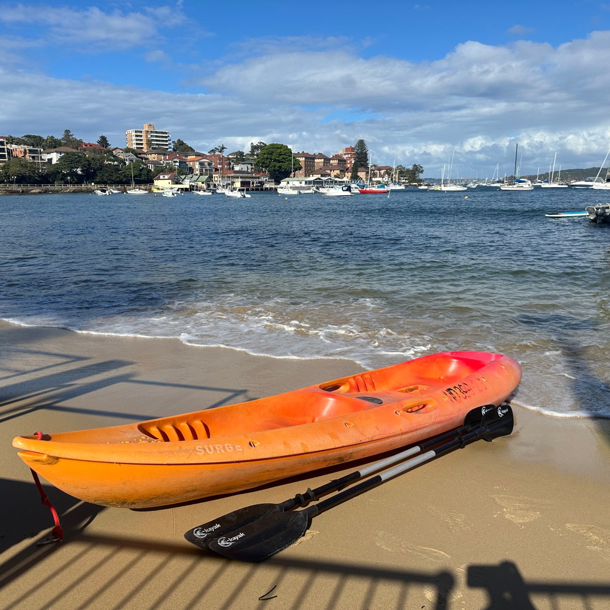 a boat sitting next to a body of water