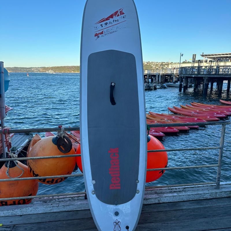 a close up of a boat next to a body of water