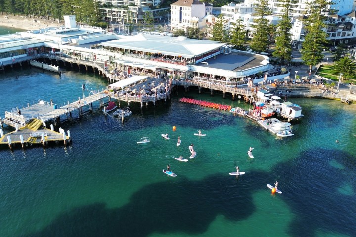 a boat is docked next to a body of water