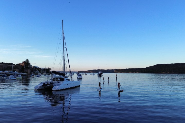 a boat is docked next to a body of water
